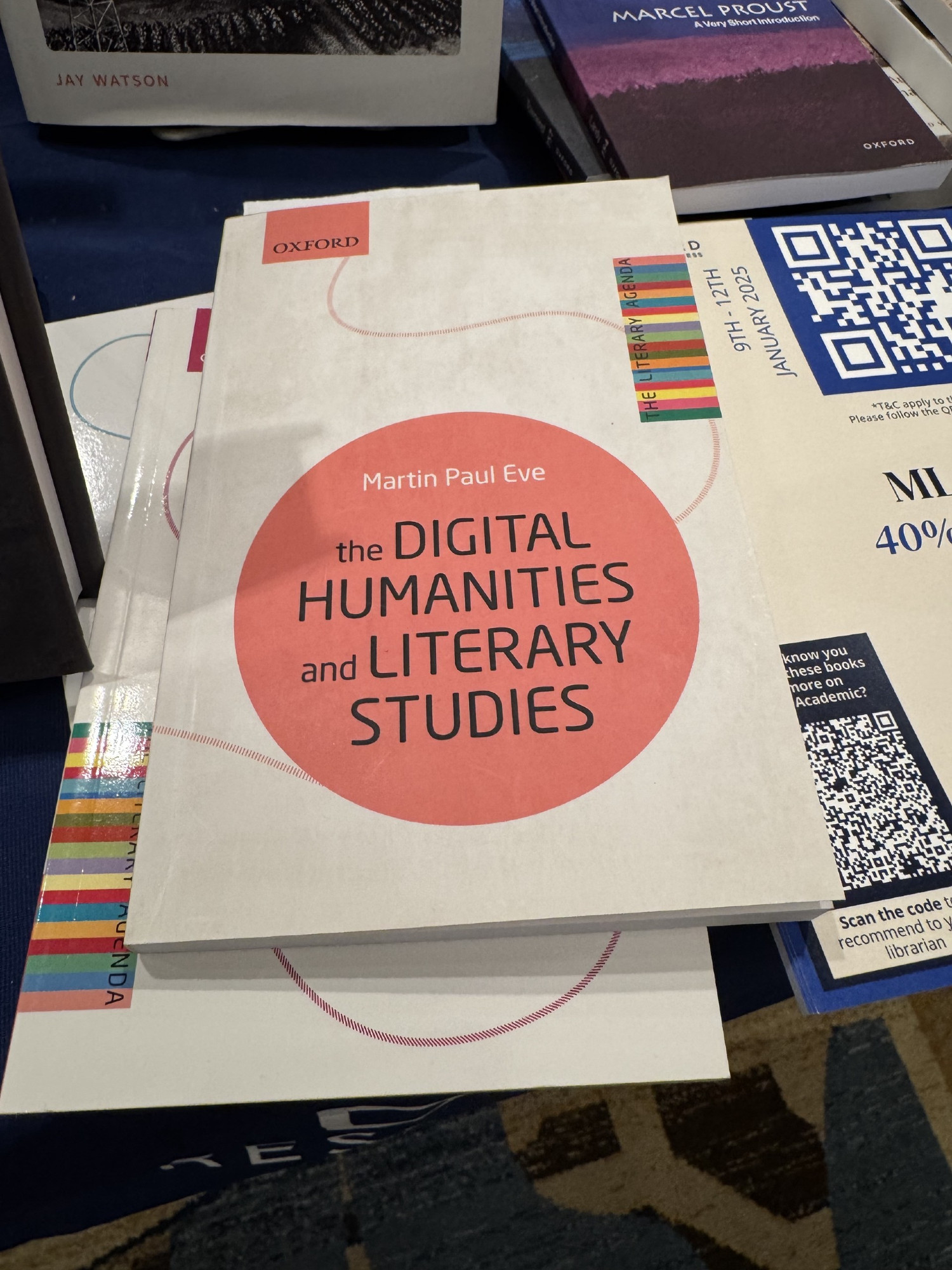 A copy of my book, Eve, Martin Paul, The Digital Humanities and Literary Studies (Oxford University Press, 2022). It has a pink circle on the front with the cover text in it.