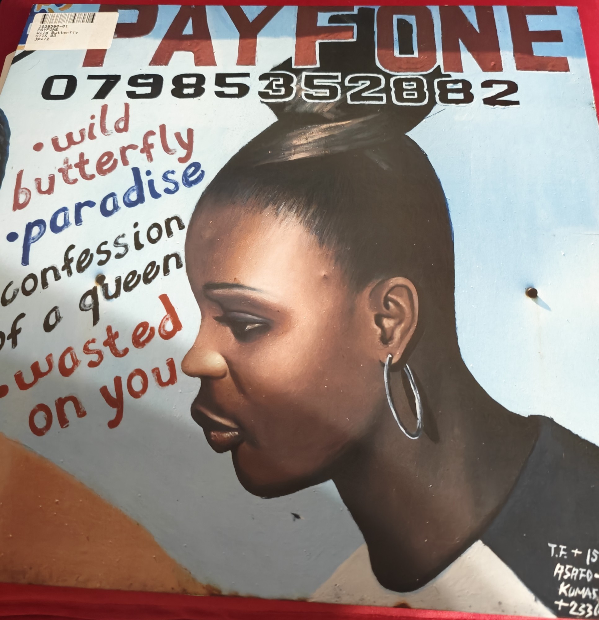 The cover to Payfone's Wild Butterfly EP. It features the text Wild Butterfly, Paradise, Confession of a Queen, Wasted on You. And the phone number 07985352882. The cover features an elegant young black woman with large earrings. 