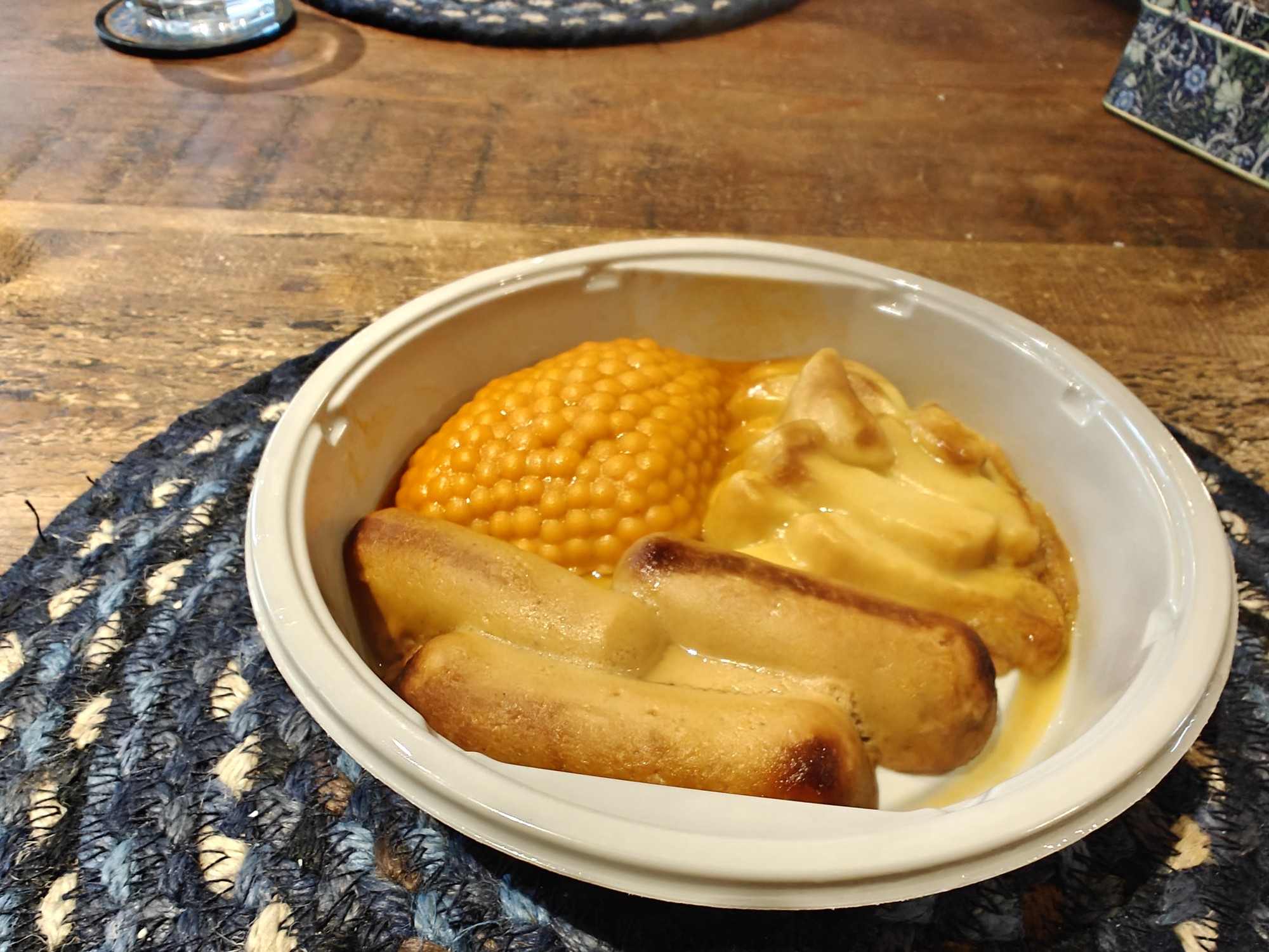 A pureed sausage, chips and beans 