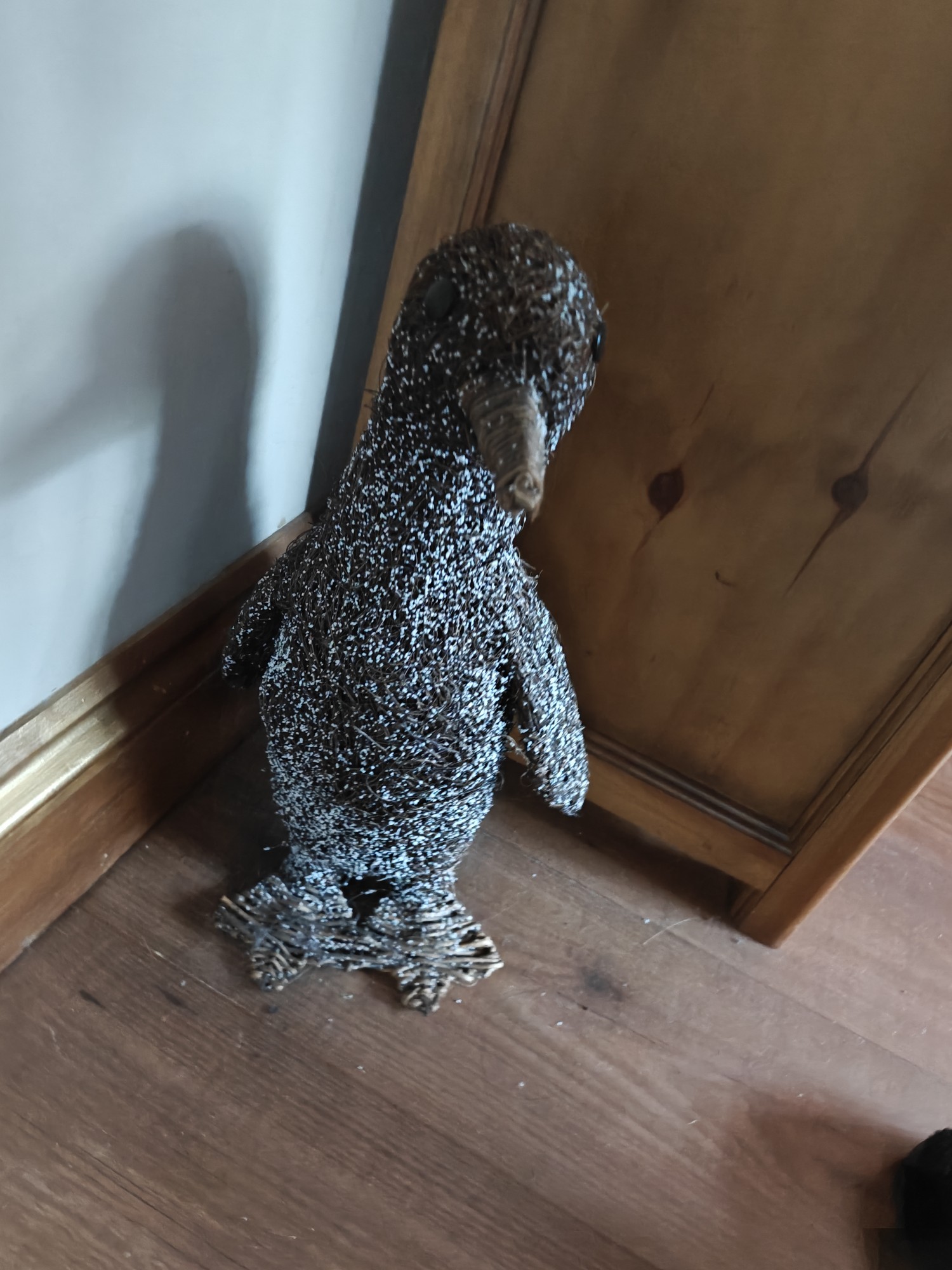 A model penguin, about a foot high 