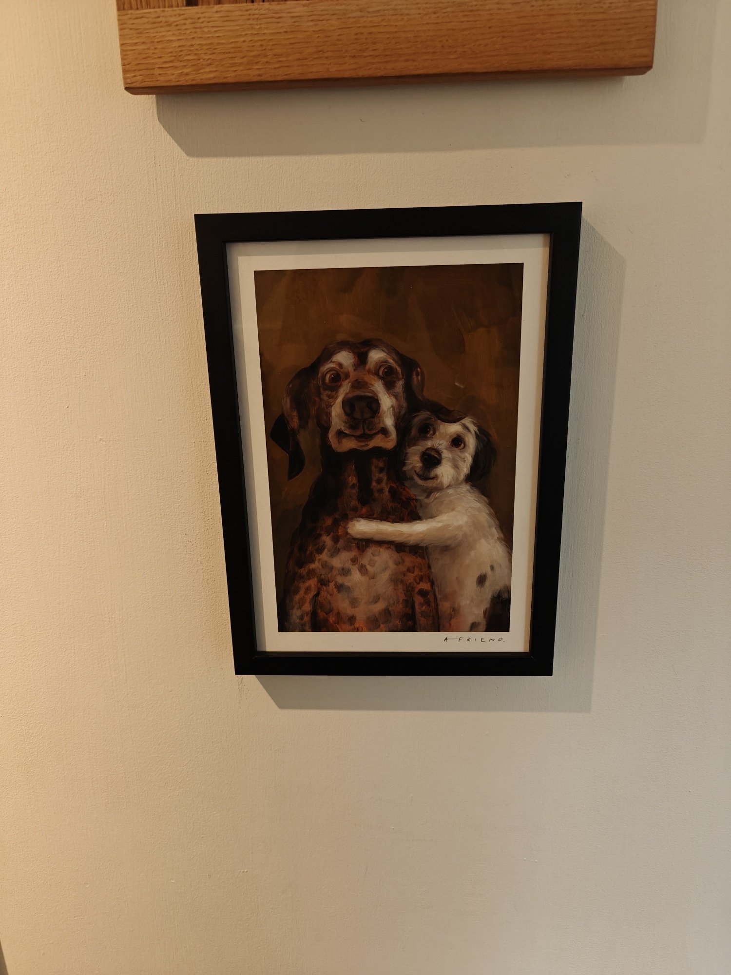 A print by Alison Friend called Best of Friends, that features two dogs cuddling 