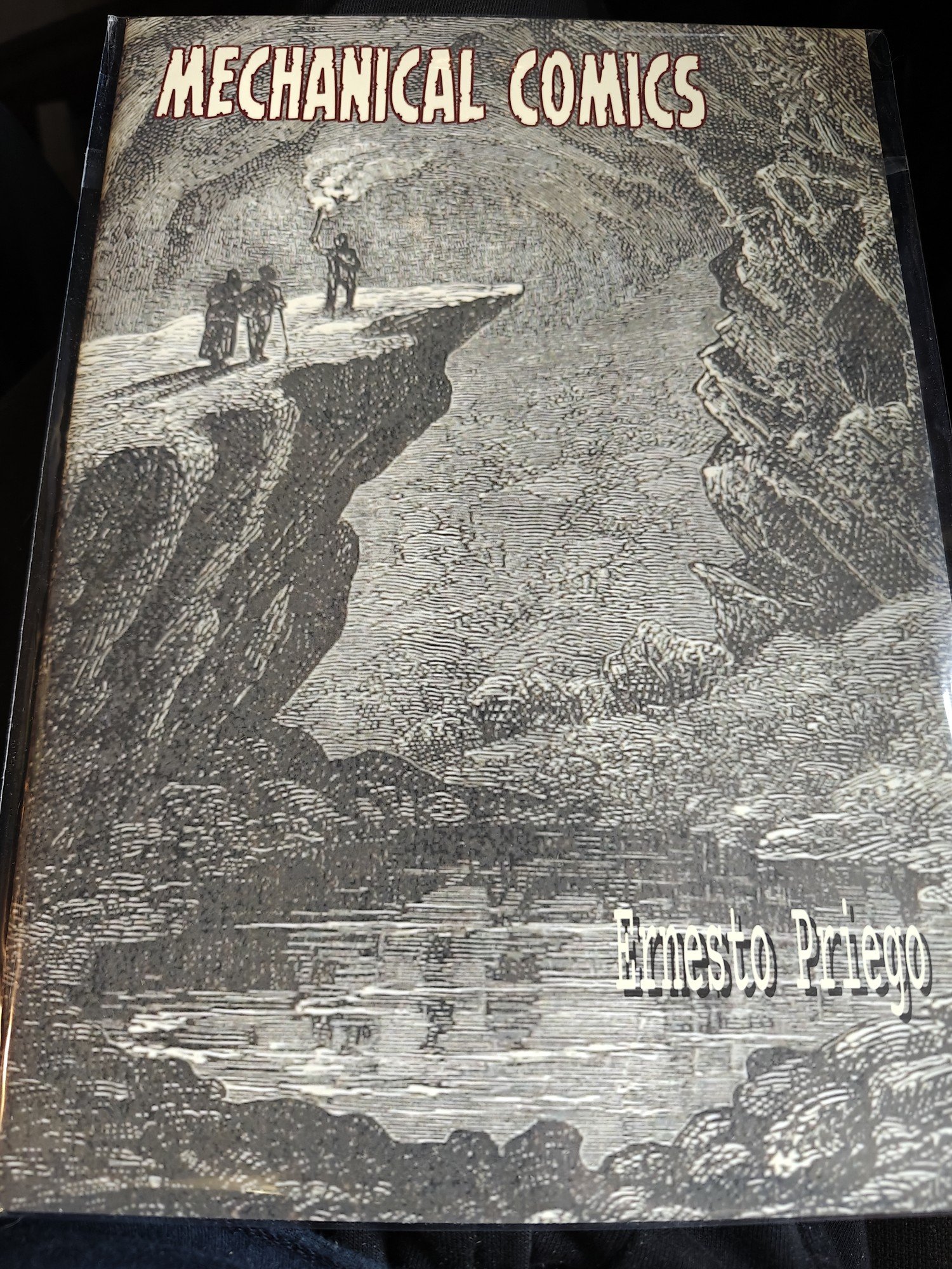 A picture of some men climbing a precipe. This is the cover to Mechanical Comics. 