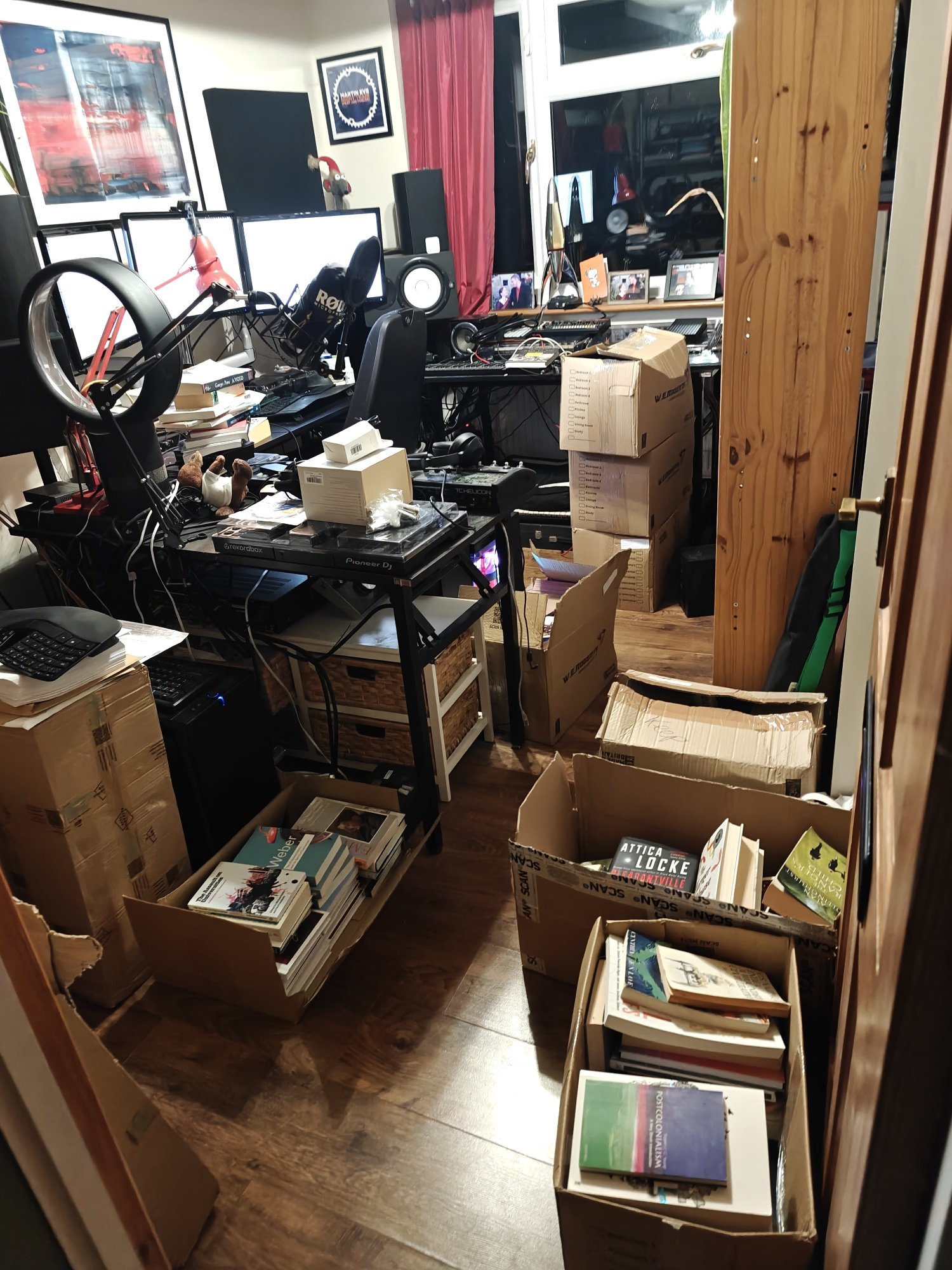 An office space crammed full of boxes of books