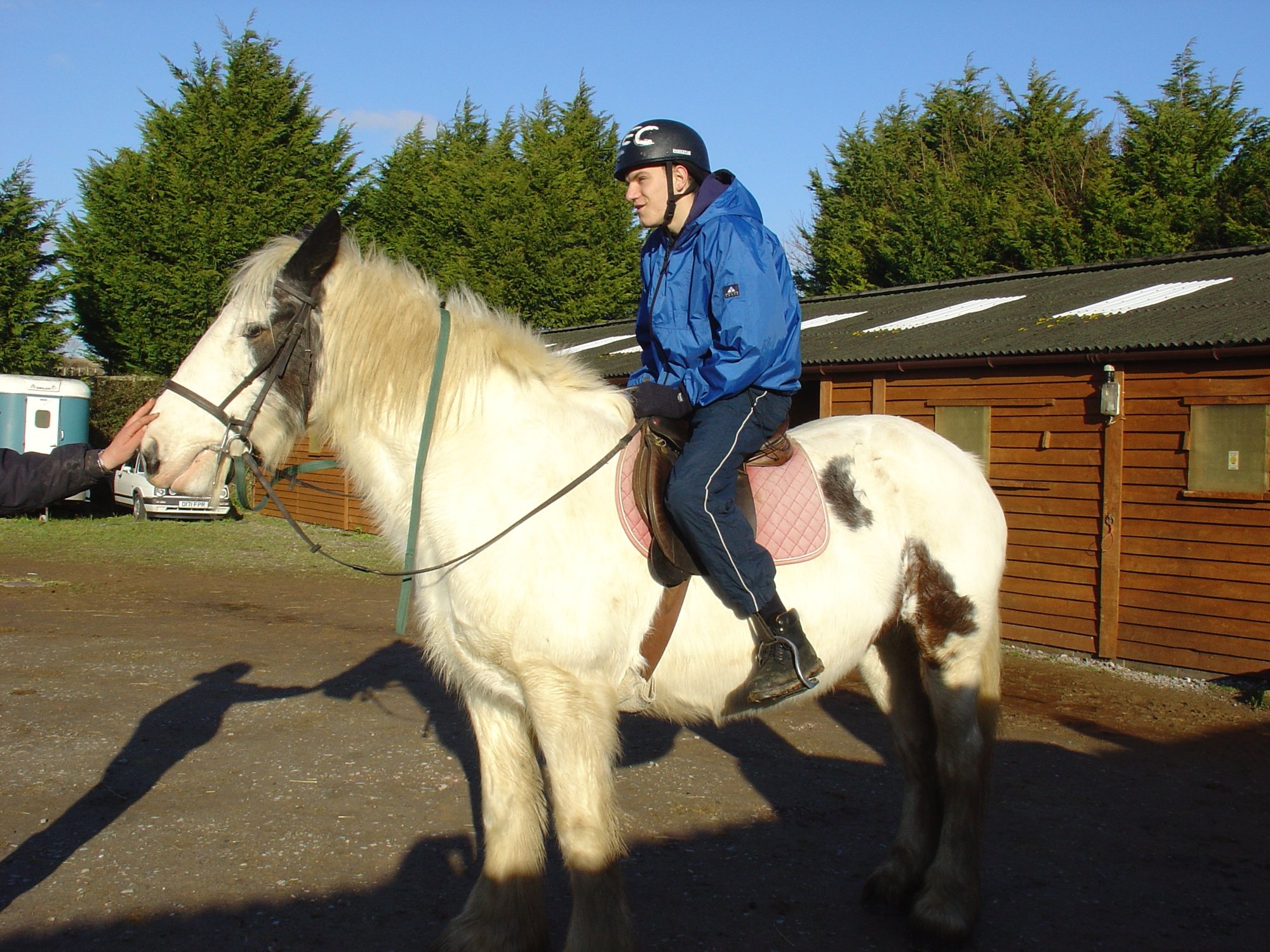 Me, 22 years ago, on top of a white horse - me leaning forwards