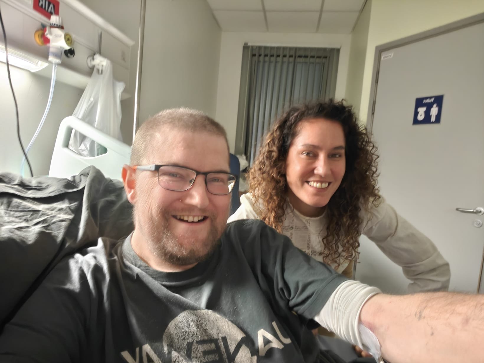A picture of me, Martin Paul Eve, and Paula Clemente Vega in a hospital room - we are smiling and happy.