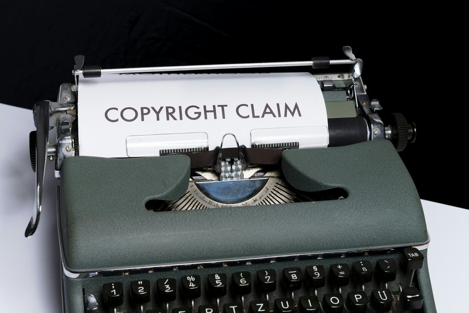 An image of a typewriter printing the words Copyright Claim