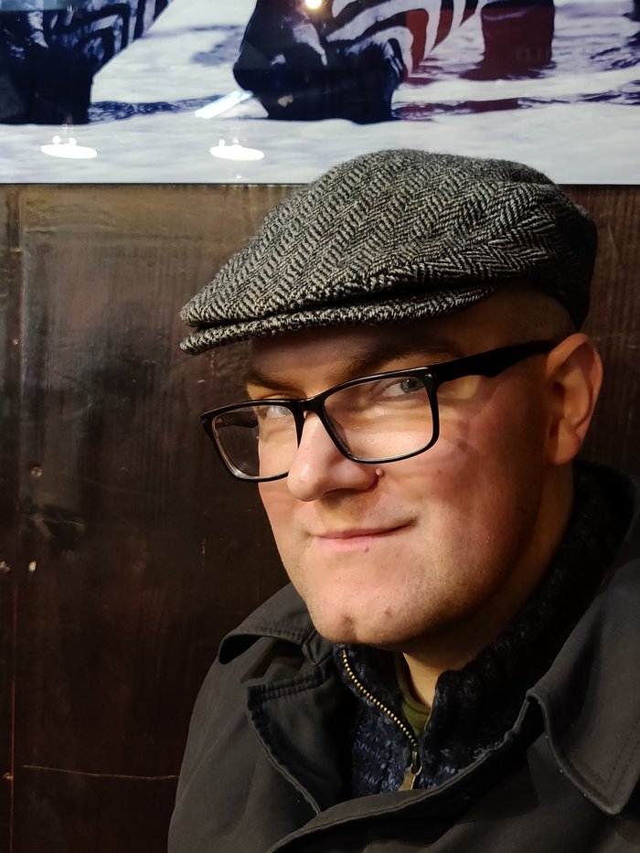 Another informal image in a flat cap