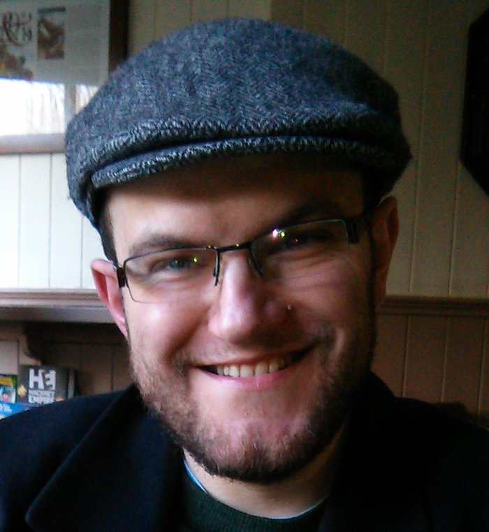 An informal image in a flat cap